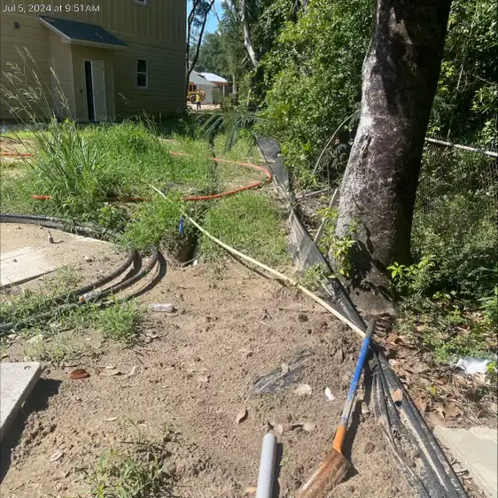 Completed irrigation installation with active sprinkler zone