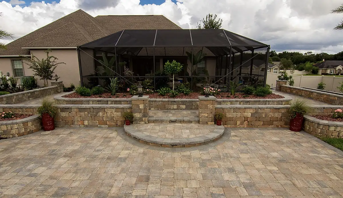Paver patio with retaining wall and landscaping in Pensacola FL