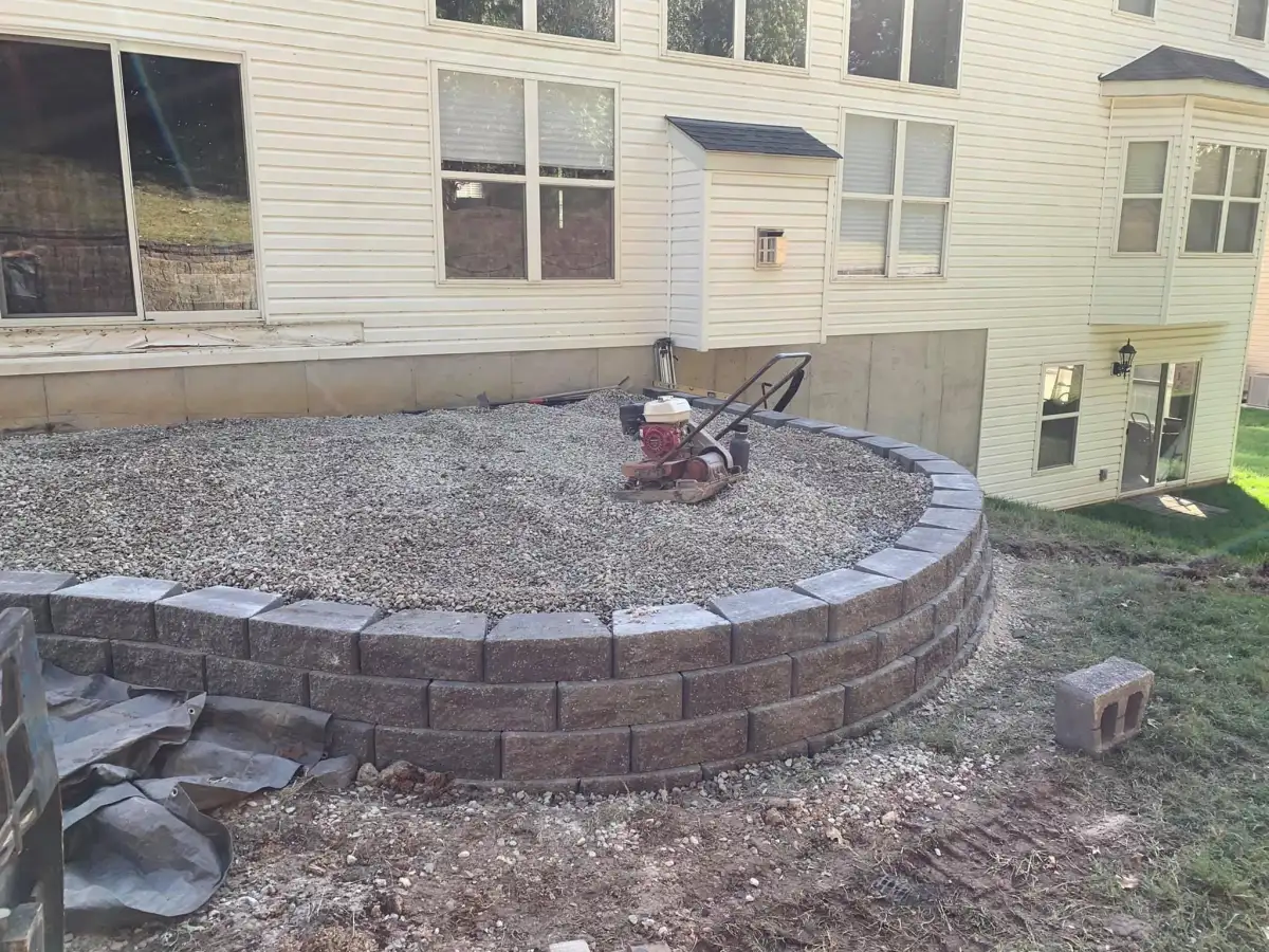 Retaining wall installation with block construction